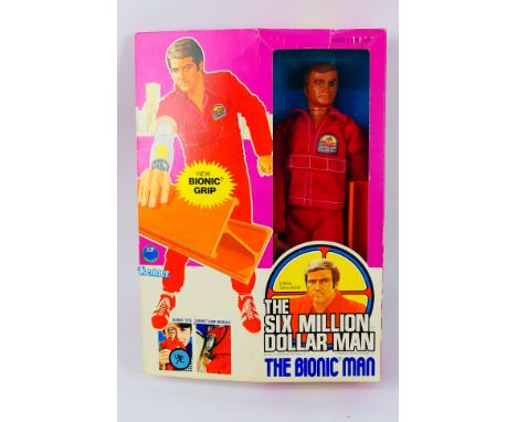 Kenner - A boxed Kenner 'Steve Austin - Six Million Dollar Man with Bionic Grip' 12" figure. This USA released version 2 figu