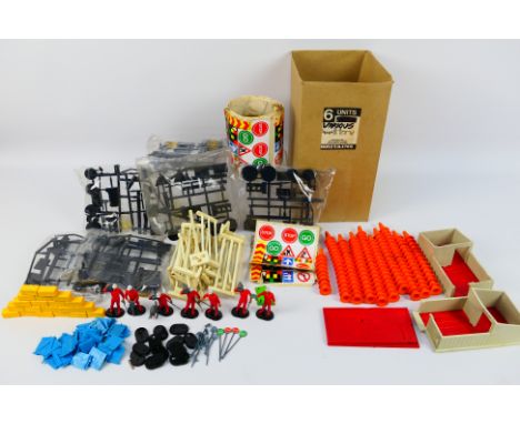 Britains - An unboxed mixed collection of Britains parts, unfinished parts and decals. Lot includes, fences, a pig sty; pig s