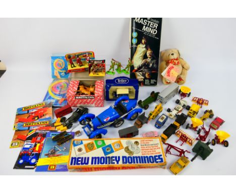Britains - A mixed lot of boxed / carded and loose Britains items, with a collection of playworn diecast toys and vintage gam