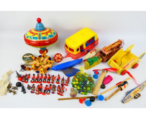 Britains - Tri-ang - Tudor Rose - Tiger Toys - A collection of vintage toys, a Tri-ang Choral spinning top, a Tudor Rose cara