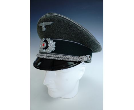 A German Third Reich army officer's peaked cap bearing propaganda / War correspondent's  waffenfarbe