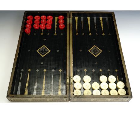 A 19th Century Chinese export gilt black lacquer folding chess and backgammon board, together with 16 turned ivory checkers, 