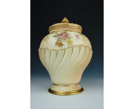 A Royal Worcester blush ivory pot pourri vase and covers, of fluted and shouldered form, the decoration incorporating delicat