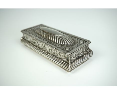 A Victorian silver bijouterie or trinket box, of rectangular section and Georgian influence, gadrooned and florally engraved,