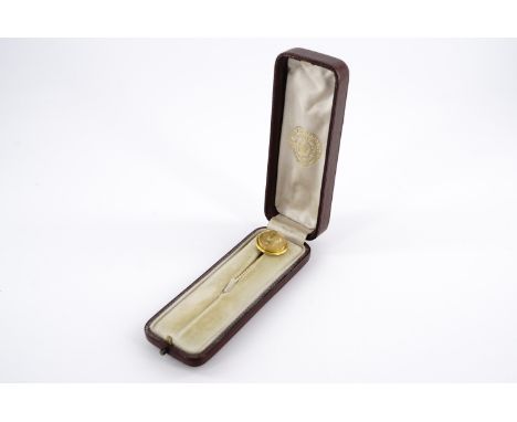 A gold memorial stickpin for John Brown presented by Queen Victoria, the terminal bearing a relief portrait profile of Brown,