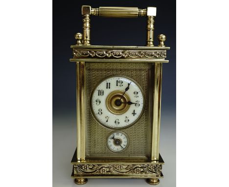 A late 19th / early 20th Century brass cased carriage alarm clock, 12 cm high (excluding finials and handle)