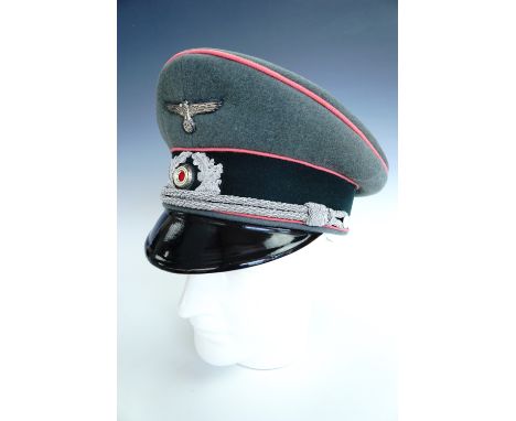 A German Third Reich army officer's peaked cap bearing panzer waffenfarbe