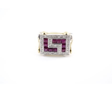A contemporary Art Deco influenced ruby and diamond reversible dress ring, having a rectangular face set with channel-set squ