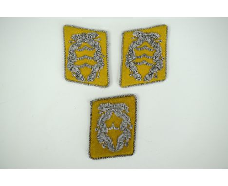 A pair of German Third Reich Luftwaffe aircrew oberst's collar patches together with a single leutnant's patch