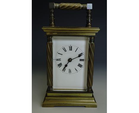 An antique French carriage clock, the brass case having spirally fluted handle and columns, late 19th / early 20th Century, 1