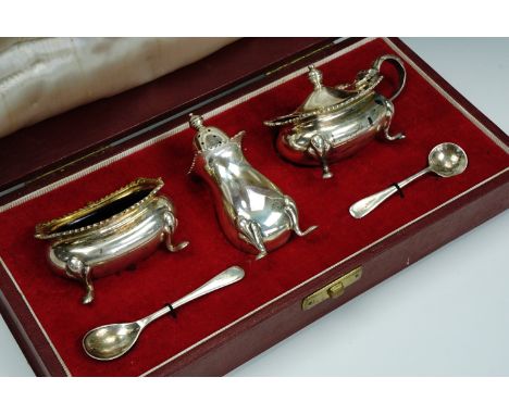 A cased set of 1960s Asprey silver cruets, of Georgian form and comprising a salt cellar, mustard pot, spoons and pepperette,