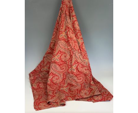 An antique red paisley printed cotton bed spread, of Art Nouveau influence, having clusters of boteh in the form of leaves, p