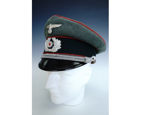 A German Third Reich army officer's peaked cap bearing artillery waffenfarbe 