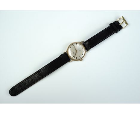 A 1970s Summit 9 ct gold wristwatch, having a 17 jewel manual wind movement with brushed silver face, baton markers and penci