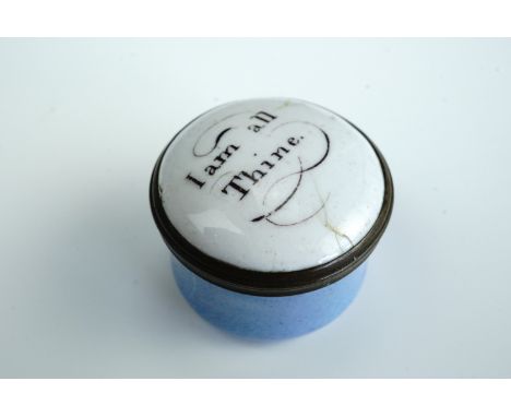 A Georgian enamelled patch box, the cover bearing the message "I am all thine", 3 cm diameter x 2 cm high, late 18th Century