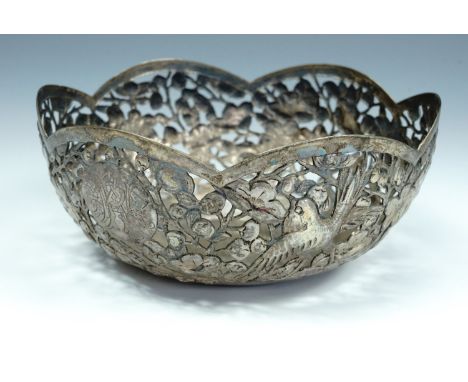 A 19th Century Chinese export white metal bowl, circular with a cusped rim, pierced, repousse-worked and engraved in depictio