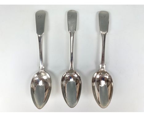 Three George III and William IV Scottish Provincial silver table spoons, fiddle pattern, each engraved with an initial, each 