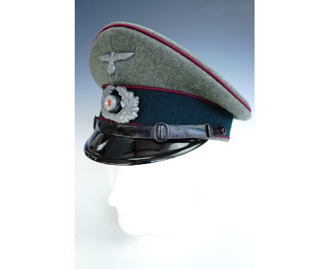 A German Third Reich army enlisted man's / NCO's peaked cap bearing Nebelwerfer troops waffenfarbe