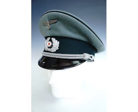 A German Third Reich army officer's peaked cap bearing engineers waffenfarbe