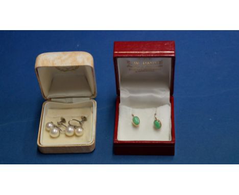 A pair of 9ct mounted jade earrings; together with a pair of 9ct double pearl screw earrings.