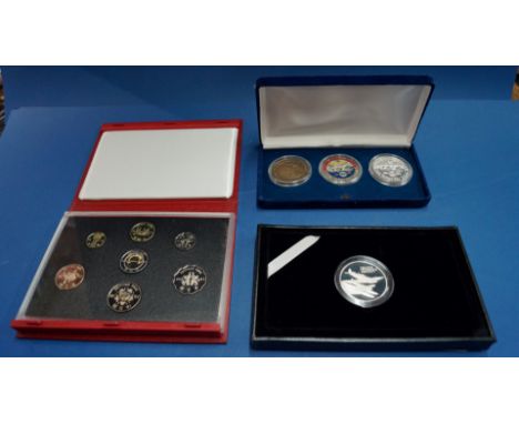 A boxed Royal Mint 'R J Mitchell' silver proof centenary medal; together with a Hong Kong 1997 commemorative proof coin colle