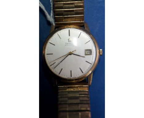 A 1970s Omega 9ct gold gentleman's automatic wristwatch, having signed 3cm silvered dial decorated baton markers and date ape