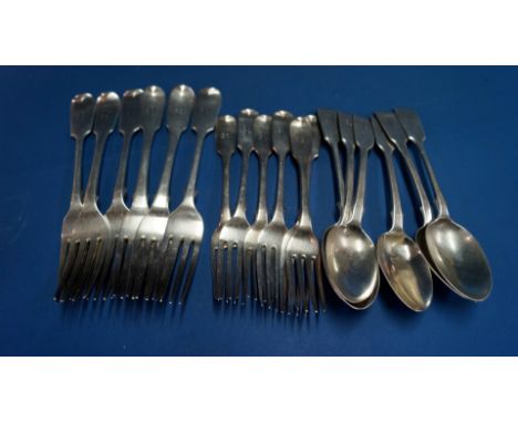 A quantity of Georgian and later silver fiddle pattern flatware, different dates and makers, 970g.