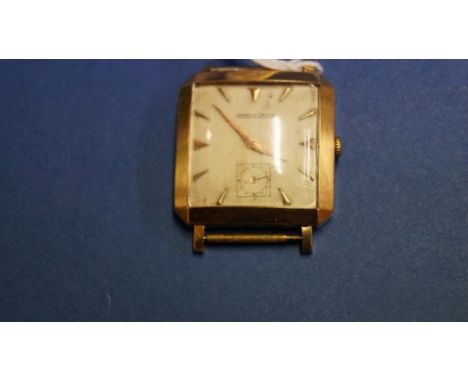 A vintage Jaeger Le Coultre 18k gold gentleman's mechanical wristwatch, having a square 2.5cm white painted dial decorated go