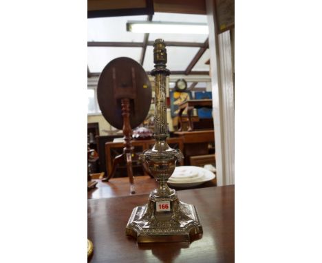 An ornate electroplated table lamp.