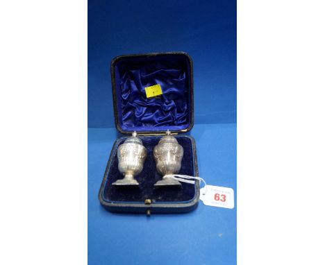 A cased pair of Victorian silver pepperettes, by Henry Wilkinson & Co, Sheffield 1890, 8.5cm, 83g.   Condition Report:  Some 