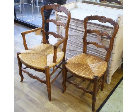 COUNTRY DINING CHAIRS, a matched set of eight, Louis XV style beechwood, each with a ladder back and rush seat, two oak carve