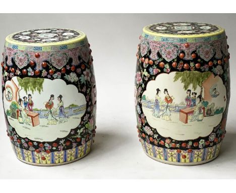 CHINESE STOOLS, a pair, Chinese pierced ceramic of barrel shape with opposing panels depicting figures, 47cm H. (2) 