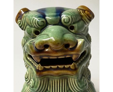 DOGS OF FOO, a pair, Chinese green and brown ceramic, 25cm H. (2) 