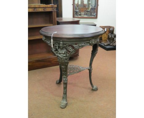 A late Victorian circular tavern table, commemorative of Slavery Abolished, circular mahogany top on cast iron tripod underfr