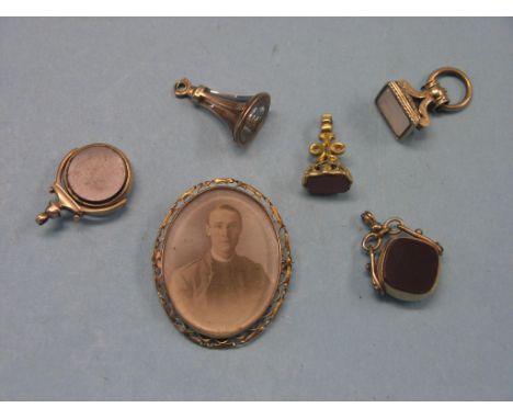 Five various gold/yellow metal seals, and an oval 9ct. gold portrait photograph brooch 