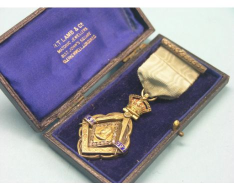 An unusual royal commemorative and masonic medal, 1897, paste-set portrait bust beneath coronet, in original leather case 