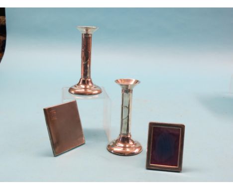 A pair of Sterling candlesticks, with tubular stems, 5.5in. together with an engine-turned silver cigarette case and a silver