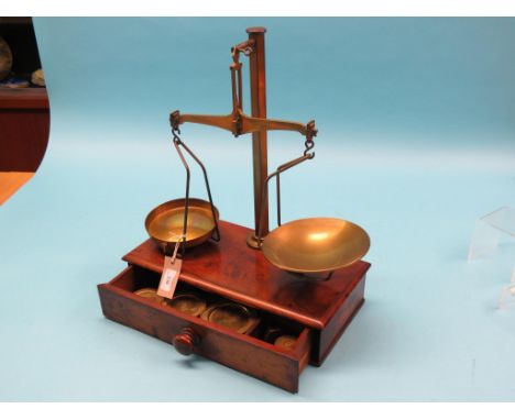 A Victorian Avery brass pan-scale, mahogany plinth with drawer containing weights 