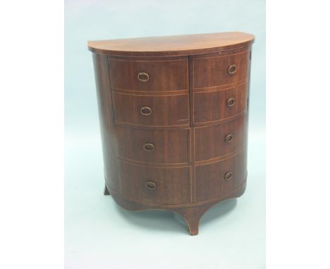 A late Georgian mahogany commode, half-round form with hinged top, eight simulated drawer-fronts with inlaid boxwood stringin