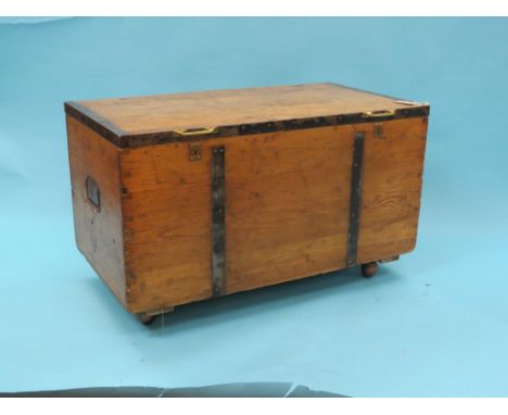 A Victorian pine cabin trunk, with metal mounts and carrying handles, 3ft. 4in.