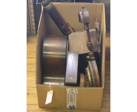 A domed oak mantel clock, carved softwood cuckoo clock, three wall-hanging barometers and a military leather-bound telescope,