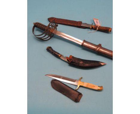 A dress sword, 31.5in. curved, single-edged blade, in steel scabbard, together with a Gurkha knife and two daggers, each with