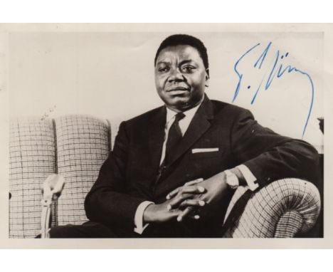 TSHOMBE MOISE: (1919-1969) President of Congo 1964-65. A scarce vintage signed 6 x 4 photograph, the image depicting a relaxe