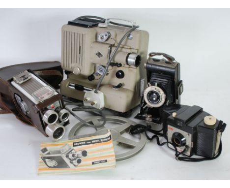 KODAK SIX-20 BROWNIE FOLDING VEST-POCKET CAMERA together with a Kodak BROWNIE 8mm MOVIE CAMERA, Turret f1.9 with brown leathe