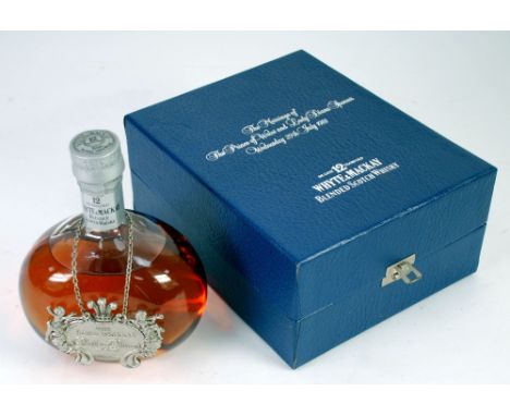 A BOTTLE OF WHYTE AND MACKAY De LUXE 12 YEARS OLD BLENDED SCOTCH WHISKY. A specially blended whisky to commemorate the Royal 