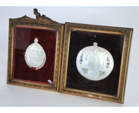 TWO 19th CENTURY CARVED MOTHER OF PEARL SHELLS in plush lined moulded gilt wood frames, both depicting religious scenes, 5" x