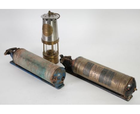 ECCLES JCM 1 BRASS AND WHITE METAL MINER'S SAFETY LAMP together with TWO BYGONE PORTABLE FIRE EXTINGUISHERS, one labelled Tet