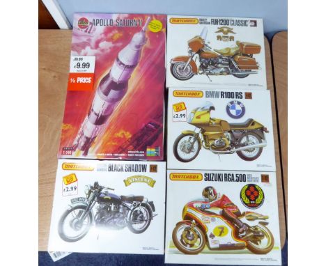 MATCHBOX FOUR 1:12 SCALE PLASTIC KITS of motorcycles and an AIRFIX 1:144 SCALE PLASTIC KIT OF A ROCKET APOLLO SATURN V (5)