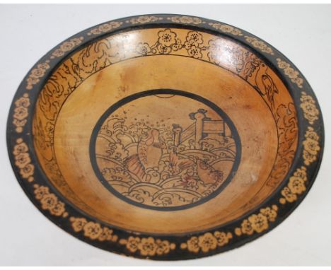B. M. LIVESEY, TURNED BLONDE WOOD BOWL of shallow form, decorated in pen and wash, the exterior with Elizabethan figures, the