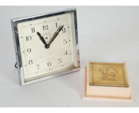 FRENCH ART DECO PORTABLE ALARM CLOCK, square with easel support, together with an EARLY PINK AND CREAM PLASTIC TABLE CIGARETT